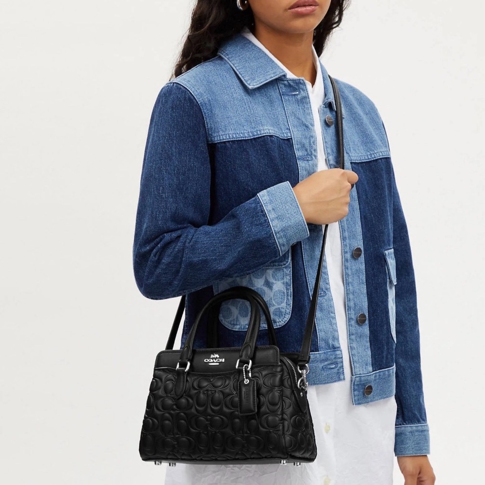 Coach Mini Darcie Carryall Bag
In Blocked Signature Canvas Black